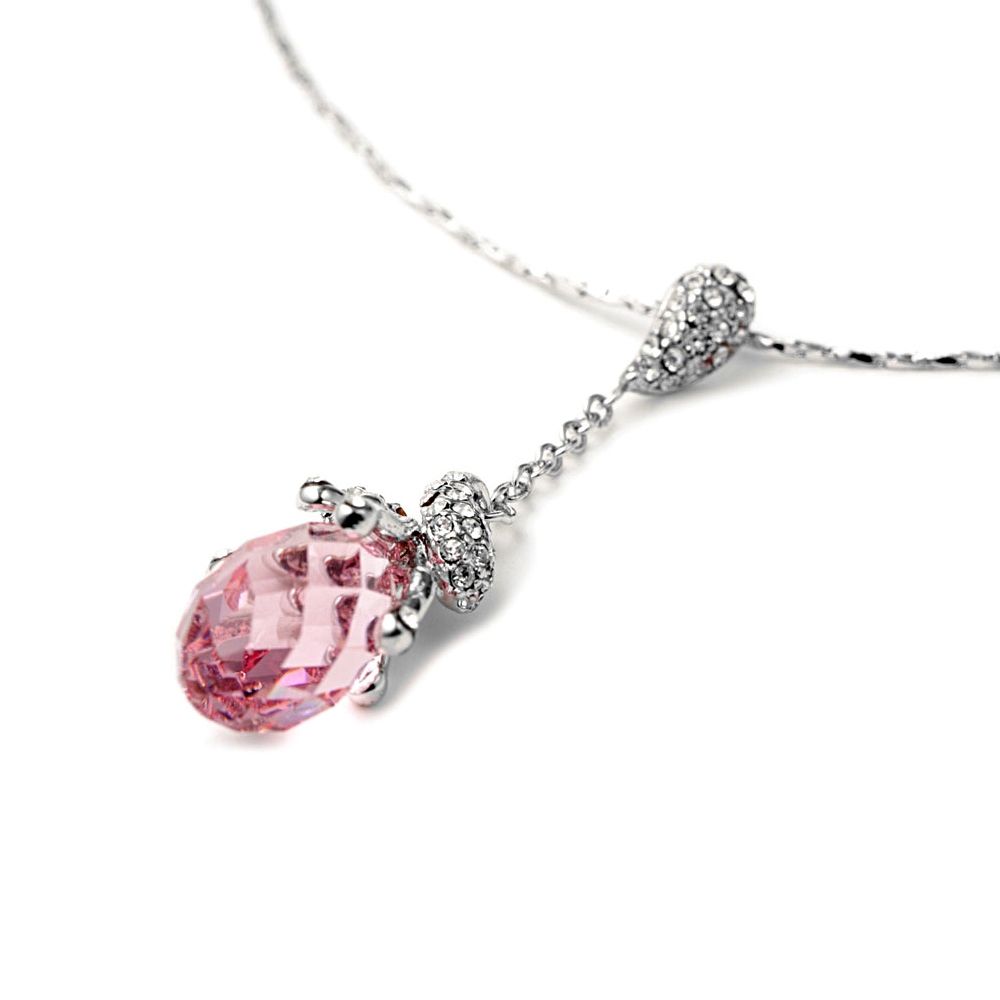 Pink Swarovski Elements Crystal Necklace Gorgeous pendant which consists of a pink Swarovski Crystal Elements teardrop cut and set on the top of white crystals. Frame high quality alloy Rhodium plated for a perfect finish and extreme shine. Pendant Length: 5 cm Crystal dimensions: 15 mm x 9 mm Crystal Color: Pink Rhodium plated frame Comes with its chain of 39 cm and adjustable (4 cm)