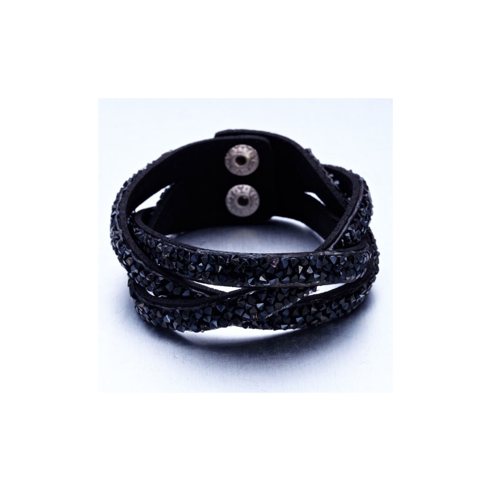 Black Swarovski Crystal Elements and Leather Interlaced Bracelet This beautiful bracelet leather black color is composed of 3 interlaced rows. These rows are set with a multitude of black Swarovski Elements crystals with intense reflections. The clasp, stainless steel is double pressure for easy and quick handling. This bracelet sparkles and you sublimate at your parties! Dimensions: 20 cm x 2.3 cm Succumb to the beauty of this bracelet that will not disappoint.