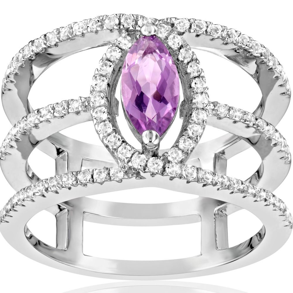 85 White and Purple Swarovski Crystal Zirconia and 925 Silver This jewel has a design that is both classic and contemporary, and is remarkable for its elegance. This beautiful ring is made up of 85 white and purple semi precious Swarovski Crystal Zirconia. They give their intense reflections at the height of the diamond. With its unique design, this gem will add elegance and brightness for any occasion key. 925 Silver and Rhodium plated 85 Swarovski Cubic Zirconia 5A Dimensions : 1.2 x 0.7 cm Weight : 5.01 gr
