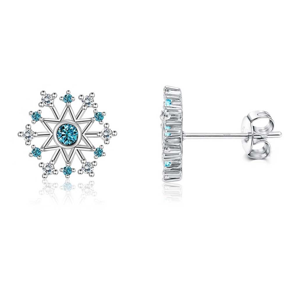 Snowflake Dangling Earrings Pair of snowflake-shaped dangling earrings made of white Swarovski crystals and a blue central crystal. Frame rhodium plated. Dimension: 1 x 1 cm