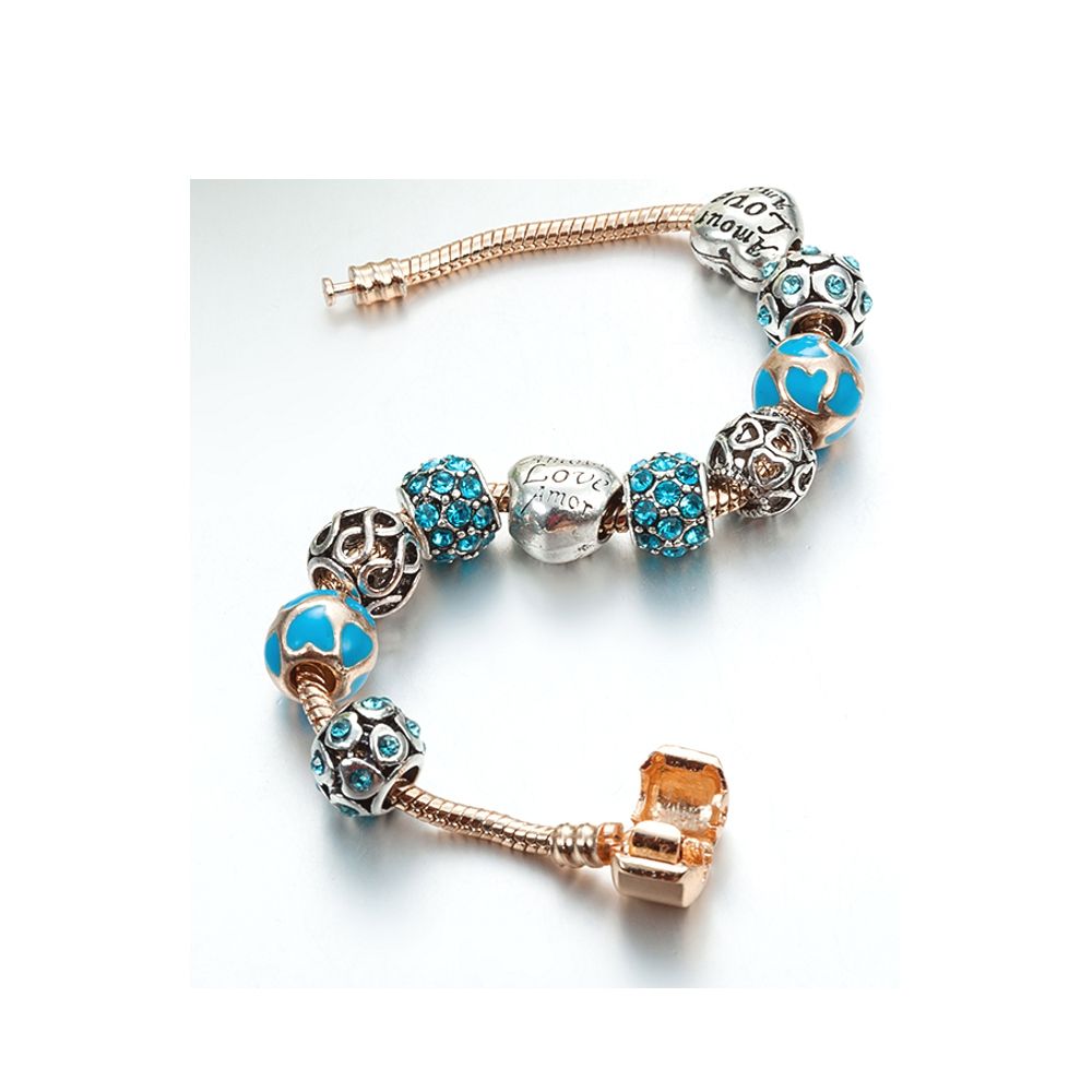 Hearts Charm's and Beads Bracelet and Stainless Steel Yellow gold plated With few differents beads on the theme of Love Principal color : Blue The alloy is stainless steel. Width : : 1 cm Bracelet length: 18 cm