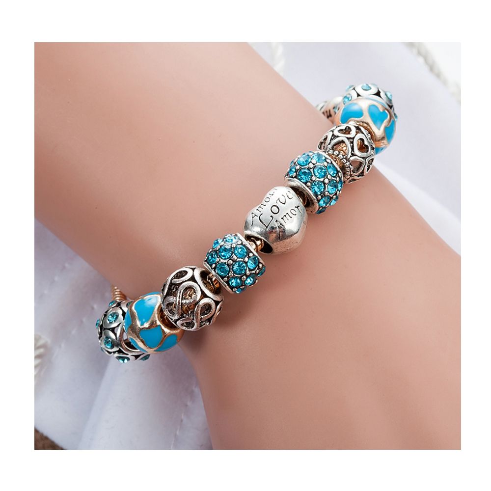 Hearts Charm's and Beads Bracelet and Stainless Steel Yellow gold plated With few differents beads on the theme of Love Principal color : Blue The alloy is stainless steel. Width : : 1 cm Bracelet length: 18 cm