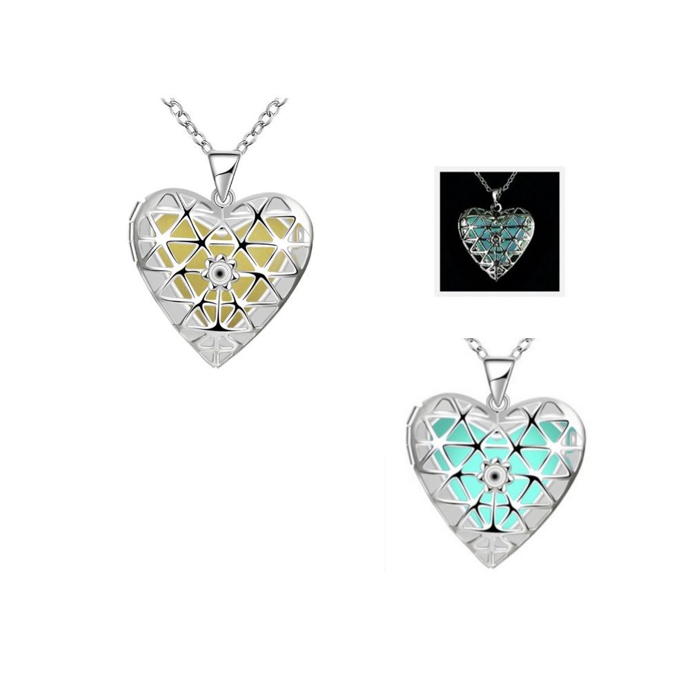Blue Fluorescent Heart Pendant Very original this necklace composed of a heart pendant containing a fluorescent stone. It will come alive in blue in the night ! Frame: Silver plated Dimension: 2.4 x 3.4 cm Length of the chain: 50 cm Weight: 2.8 g