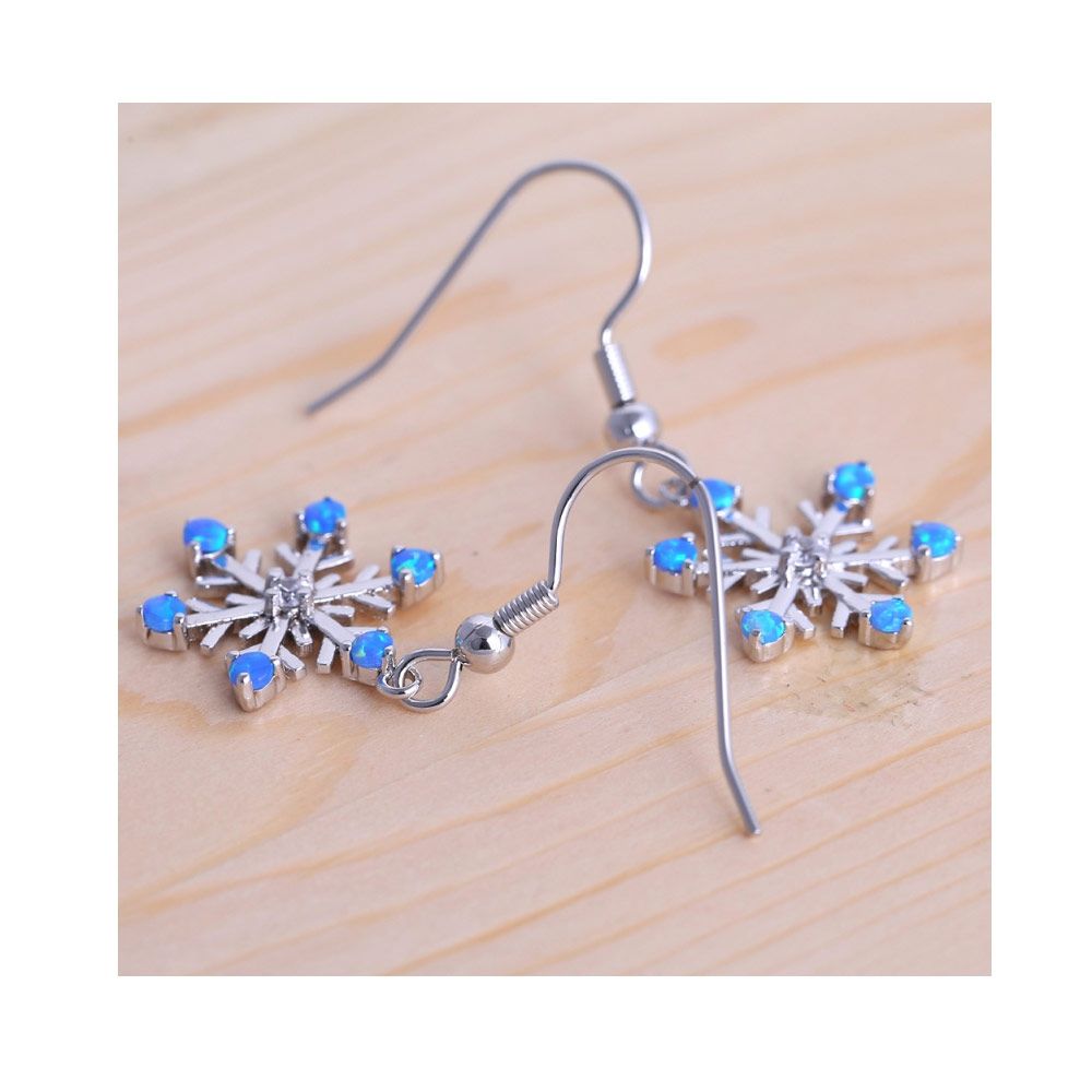 Opal Snowflake earrings and Silver Plated This beautiful Snowflake-shaped earrings is composed of Opal multiple shimmering and fluorescent reflections. The Mounting is silver plated. Dimensions : 3.6 x 1.5 cm Hooks Earrings