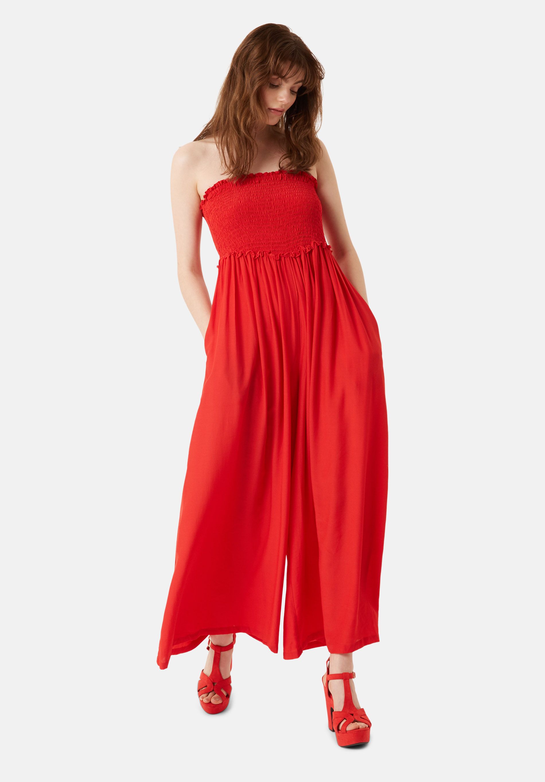 The Smock Jumpsuit is a sophisticated design to elavate your daywear. Realised in a deep red shade, this stretch-cady one-piece is cut to a sleek strapless fit, before it tumbles to a soft flared wide leg. 70% Viscose, 30% Polyester. Machine Wash at 30c
