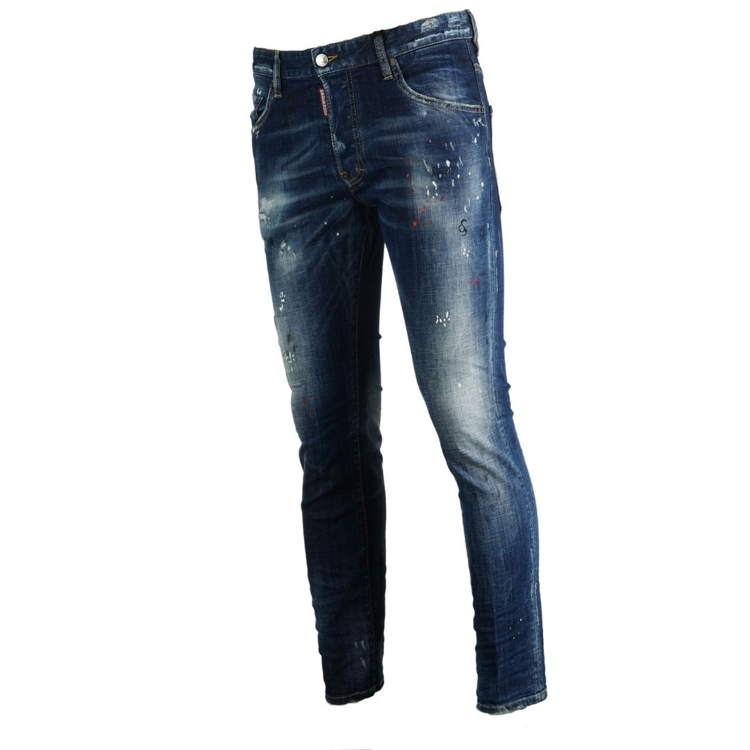 Dsquared2 Skater Jean Paint Splash Distressed Jeans. Dsquared2 Skater Jean S74LB0593 S30342 470. Stretch Denim 98% Cotton 2% Elastane. Button Fly, Made In Italy. Slim Fit With A Tapered Leg. Large Branded Badge ,Paint Splash Detail, Destroyed Reinforced Denim