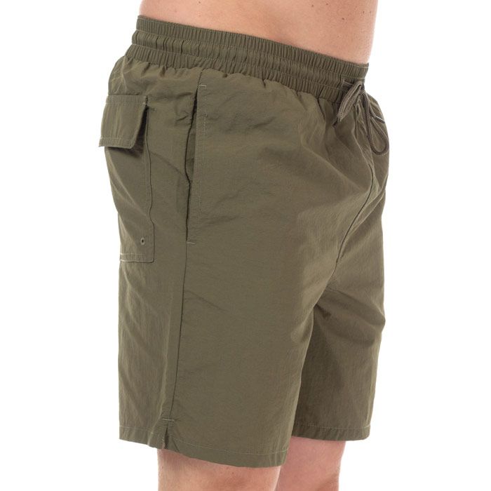 Mens Lyle And Scott Plain Swim Shorts in lichen green.<BR><BR>- Elasticated waist with drawcord. <BR>- Side welt pockets. <BR>- Rear flap pocket with hook and loop closure.<BR>- Side split hems.<BR>- Inner mesh briefs.<BR>- Embroidered eagle logo at left hem.<BR>- Regular fit.<BR>- Inside leg length measures 6.5“ approximately.<BR>- Shell: 100% Nylon.  Lining: 100% Polyester.  Machine washable.<BR>- Ref: SH1204VZ801<BR><BR>Measurements are intended for guidance only.