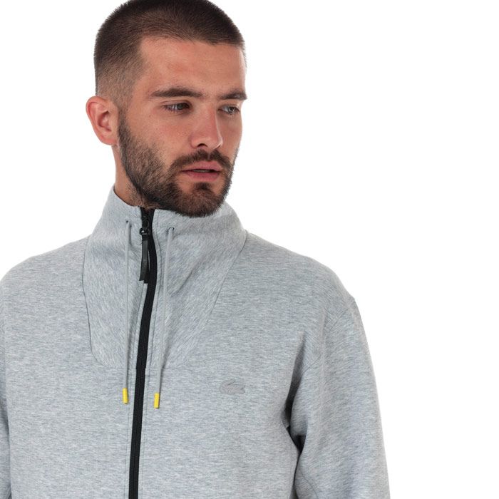 Mens Lacoste Motion Ergonomic Cotton Blend Zip Sweatshirt  Grey.  <BR><BR>- Stretch Milano cotton.<BR>- Contrast elasticised edge three-part hood.<BR>- Contrast zip side pockets.<BR>- Lacoste designer silicone badge at back and elasticised finishes at bottom of garment.<BR>- Silicone crocodile on chest.<BR>- Cotton 78%  Polyester 17%  Elastane 5%. Machine washable.<BR>- Ref: SH860100CCA.