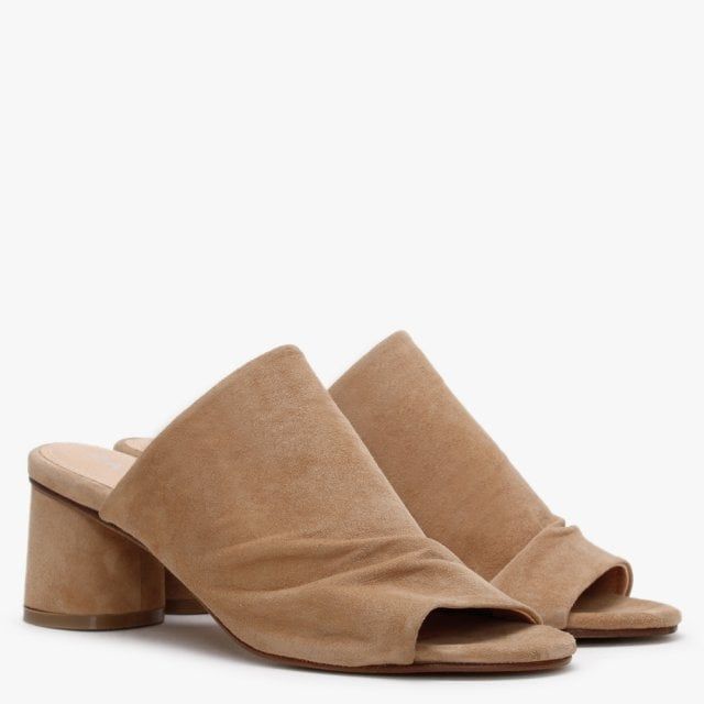 Add the Daniel Silvia Suede Slouchy Mules to your New Season wardrobe. This simple yet chic everyday style is crafted from a premium suede upper with luxurious leather lining. An easy to wear classic slip on style featuring slouchy upper, peep toe and wrapped heel. Signature Daniel branding is seen on the foot-bed.