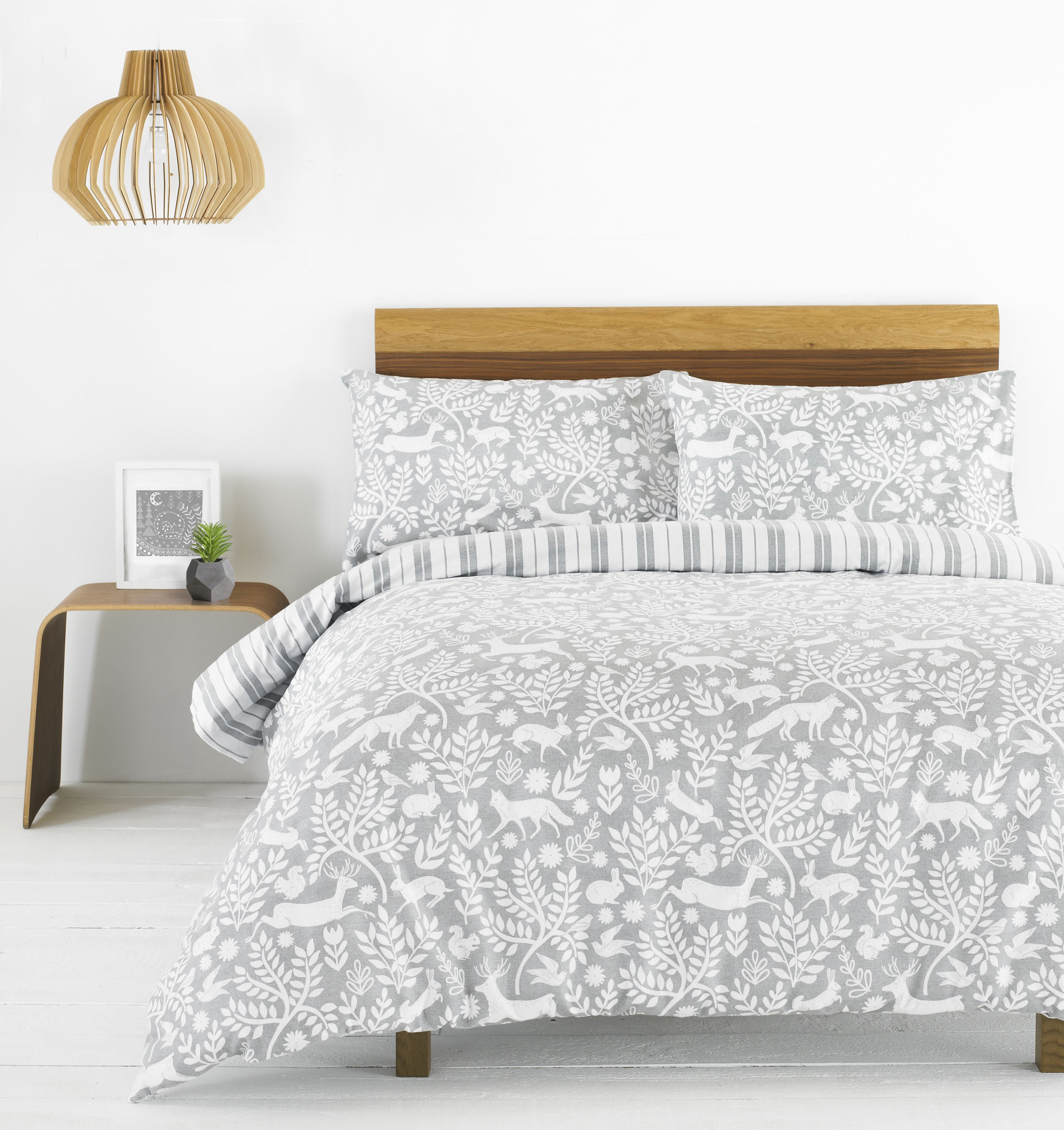 The Paoletti Skandi Woodland duvet cover set is a versatile piece during the colder seasons. Featuring an intricate design of woodland animals from hares to foxes intertwined with branches in a minimal colour scheme of grey and white it will match most home interiors. Perfect as a base to dress up with interesting textures and minimal colours. The unique design flows onto matching housewife pillowcases which each have an easy envelope closure. As this duvet cover set is made of beautiful 100% brushed cotton flannelette fabric you’ll be rushing to bed each night. Fully machine washable at 40 degrees this duvet cover is a breeze to take care of and is appropriate to tumble dry. Iron on a hot setting for the best results.