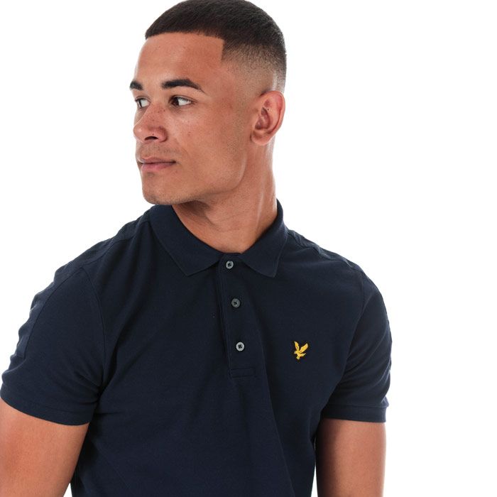 Mens Lyle And Scott Fabric Mix Polo Shirt in navy.<BR><BR>- Ribbed polo collar.<BR>- Three button placket.<BR>- Short sleeves with ribbed cuffs.<BR>- Tonal tape detail at shoulders and sleeves.<BR>- Even vented hem.<BR>- Embroidered eagle logo at left chest.<BR>- Woven herringbone back neck tape.<BR>- 100% Cotton piqué.  Machine washable.<BR>- Ref: SP1225VZ99