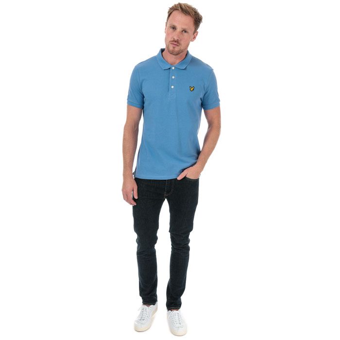 Mens Lyle And Scott Plain Polo Shirt in cornflower blue.<BR><BR>- Ribbed polo collar.<BR>- Three button placket.<BR>- Short sleeves with ribbed cuffs.<BR>- Even vented hem.<BR>- Embroidered eagle logo at left chest.<BR>- Woven herringbone back neck tape.<BR>- Regular fit.<BR>- 100% Cotton piqué.  Machine washable.<BR>- Ref: SP400VTR030