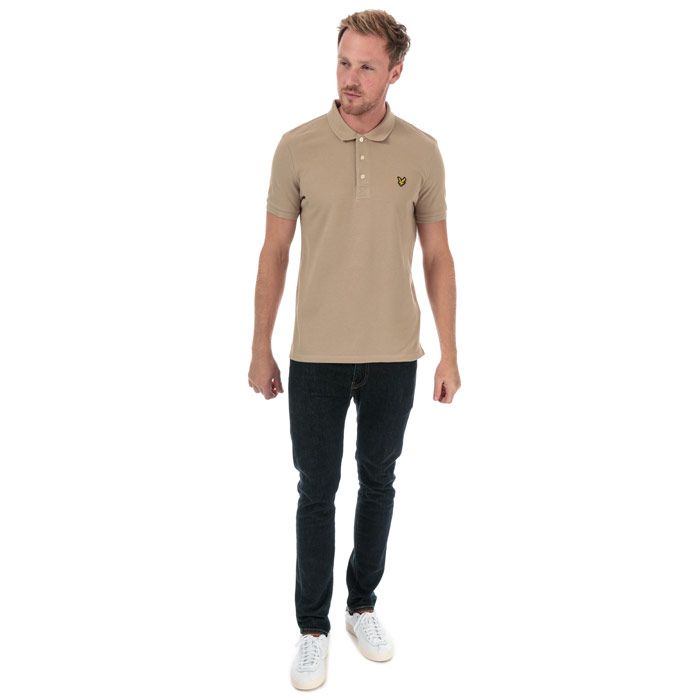 Mens Lyle And Scott Plain Polo Shirt in stone.<BR><BR>- Ribbed polo collar.<BR>- Three button placket.<BR>- Short sleeves with ribbed cuffs.<BR>- Even vented hem.<BR>- Embroidered eagle logo at left chest.<BR>- Woven herringbone back neck tape.<BR>- Regular fit.<BR>- 100% Cotton piqué.  Machine washable.<BR>- Ref: SP400VTRZ151