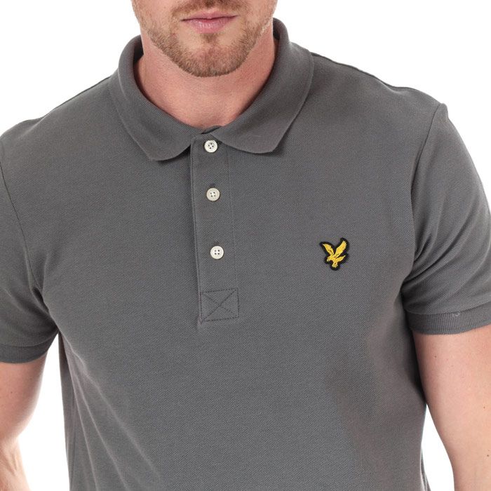Mens Lyle And Scott Plain Polo Shirt in urban grey.<BR><BR>- Ribbed polo collar.<BR>- Three button placket.<BR>- Short sleeves with ribbed cuffs.<BR>- Even vented hem.<BR>- Embroidered eagle logo at left chest.<BR>- Woven herringbone back neck tape.<BR>- Regular fit.<BR>- 100% Cotton piqué.  Machine washable.<BR>- Ref: SP400VTRZ357