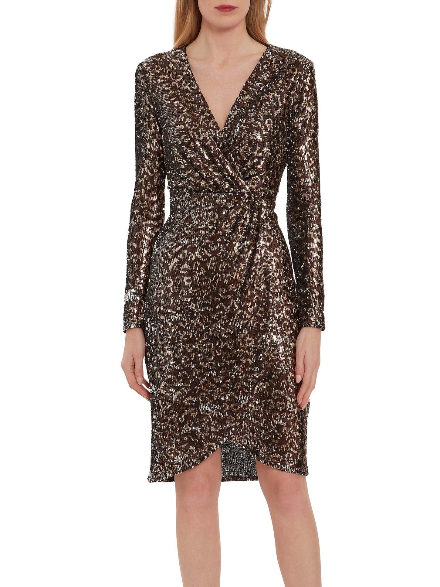 This gorgeous wrap dress by Gina Bacconi is sure to make you stand out. This low cut sequin dress is perfect for a party or special occasion. With ruching and a split hem for a classic look.