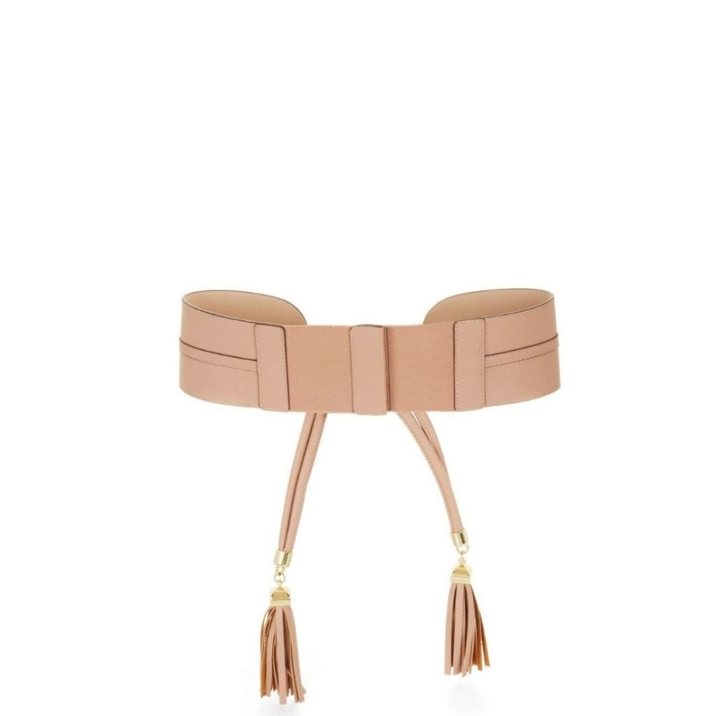Upgrade your belted accessories with this waist belt with braided knot and tassel detail. Pair it with a relaxed-fit dress for a bohemian-chic finish. Waist belt. Front knot detail. Signature hardware and tassel detail at ends. Material: Faux leather. Standard sizing. Sits at the waist. Fits true to size.