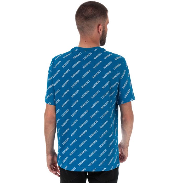 Mens Lacoste Live Signature Print T-Shirt  Blue.  <BR><BR>- Ribbed Crew Neck.<BR> -Short Sleeves<BR>- Allover Lacoste signature print.<BR>- Embroidered green crocodile patch<BR>- 100% Cotton  Machine washable.<BR>- Ref: TH8066002DB
