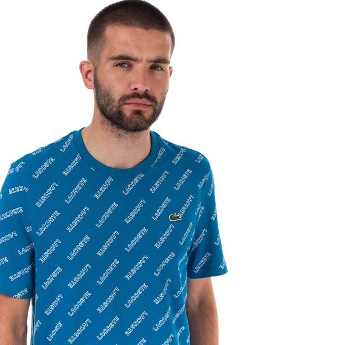 Mens Lacoste Live Signature Print T-Shirt  Blue.  <BR><BR>- Ribbed Crew Neck.<BR> -Short Sleeves<BR>- Allover Lacoste signature print.<BR>- Embroidered green crocodile patch<BR>- 100% Cotton  Machine washable.<BR>- Ref: TH8066002DB