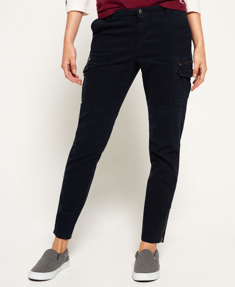 Superdry women's super skinny Cargo pants. These super skinny fitting cargo pants with ankle zips, feature eight pockets, a zip fastening and finished with a Superdry branded button fastening and belt loops.Model wears: Small Model height: 5’9” (175cm)