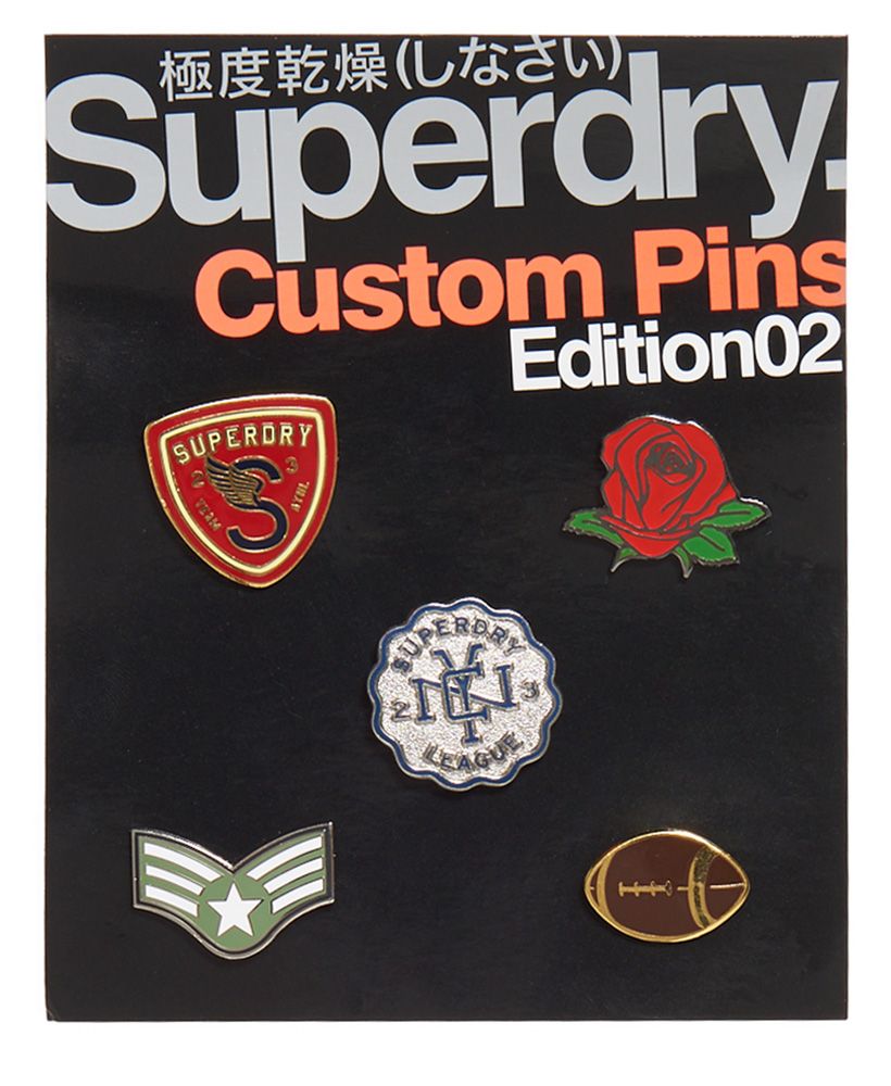 Superdry custom pin badge pack. Customise any piece of clothing this season with these varsity style pin badges. Including 5 different badges, the pack is perfect for making any item your own.