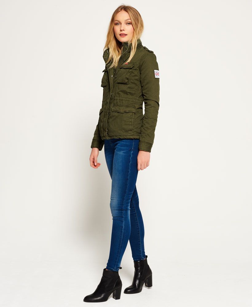 Superdry women’s winter Rookie military jacket. This fleece lined military inspired jacket features a zip and popper fastening, four front pockets, an adjustable waist and a single inner pocket. The Rookie military jacket is finished with Superdry logo patches on the chest and sleeve.Model wears: 
Small Model height: 5’11” (181cm)