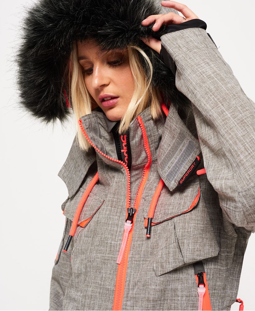 The Full Tech range from the Superdry Snow collection is designed for max performance with technical fabrics and high water resistance. This range is for skiers & boarders taking on advanced slopes and black runs.Superdry women's Ultimate Snow Service ski jacket. This ski jacket features a hood with a contrast colour lining, removable faux fur trim, drawstring adjuster, a double layer zip front fastening and taped seams to help keep the moisture out. The snow jacket benefits from eight outer pockets, a tech pocket with earphone cable routing and zipped underarm vents for added breathability. Keep your ski pass safe with a dedicated pocket on the sleeve. Inside, the removable snow skirt and snow cuffs will help keep the powder and cold out. The ski jacket is finished with Superdry logo prints on the shoulder and a Superdry Snow logo badge on the sleeve.Water resistance <10,000mm
Breathability <10,000g