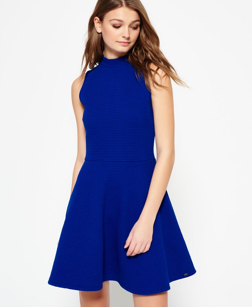 Superdry women's Erin Racer dress. A sleeveless skater dress featuring a ribbed design, a high collar and a back zip fastening. The Erin Racer dress is finished with a subtle metal Superdry logo tab above the hem.Model wears: Small Model height: 5’ 9” (175cm)