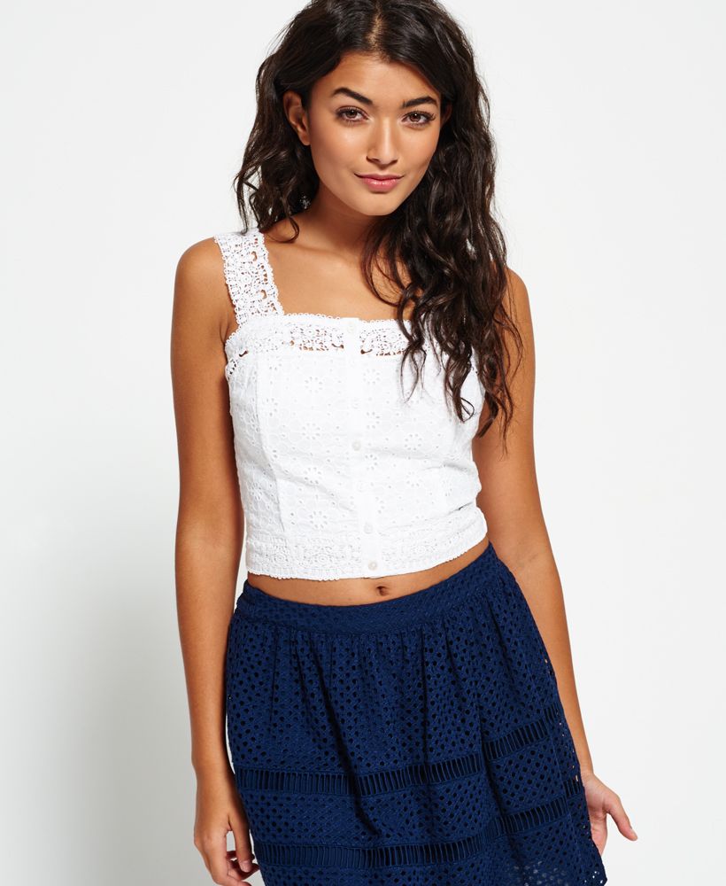 Superdry women’s Lacy mix crop top. This crop top bodice features an all over broderie anglaise with a button fastening through the middle. The Lacy mix crop top has lace straps and an elasticed back and is finished with a subtle metal Superdry logo badge near the hem.Model wears: Small Model height: 5’ 9” (175cm)