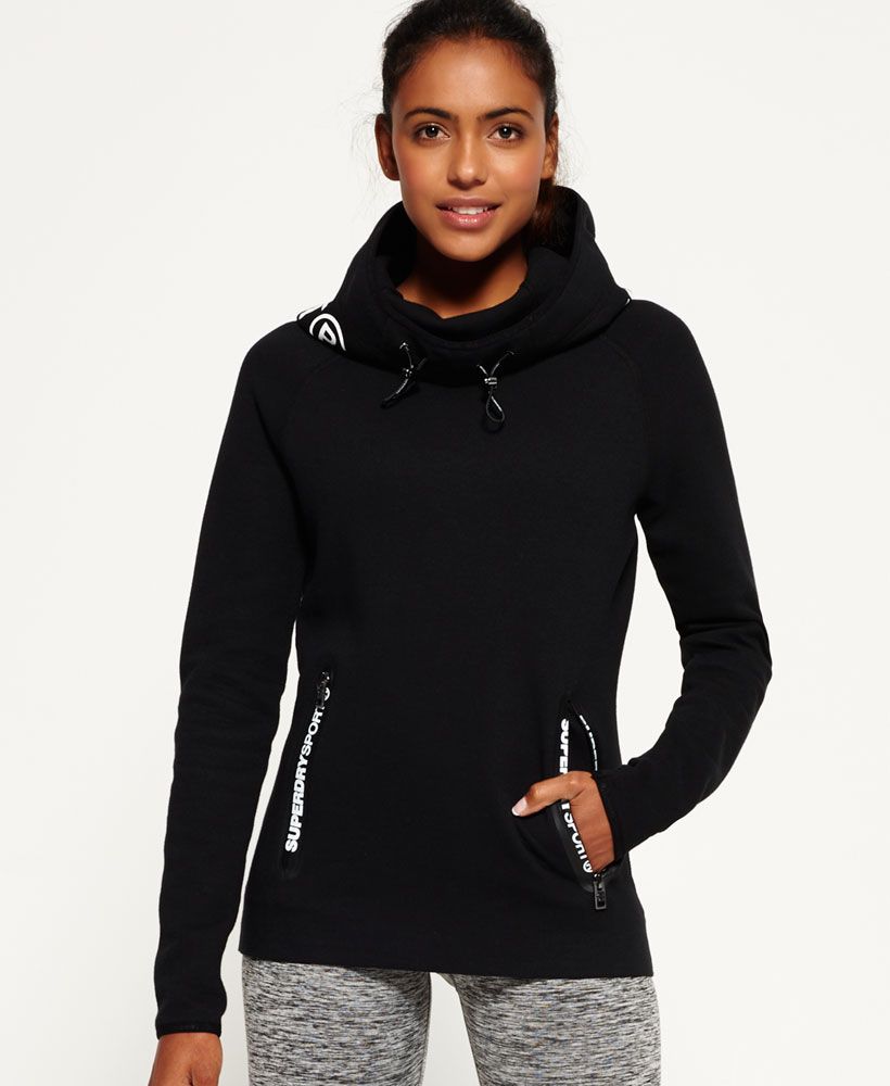 Superdry’s latest Sport Collection is this season’s must-have, combining hi-tech fabrics for professional performance fused with vivid Superdry detailing to create the ultimate fitness look. 
 Superdry women's Gym Tech Cowl Hoodie. Featuring breathable and technical bonded jersey the hoodie benefits from one front pocket with Superdry Sport printed zips and an adjustable bungee cord cowl style hood. Finished with an embossed Superdry Sport print on the back hood, it is also subtly branded with Superdry Sport hems and is designed for exercising outdoors. Model wears: Small Model height: 5’ 10” (175cm)
