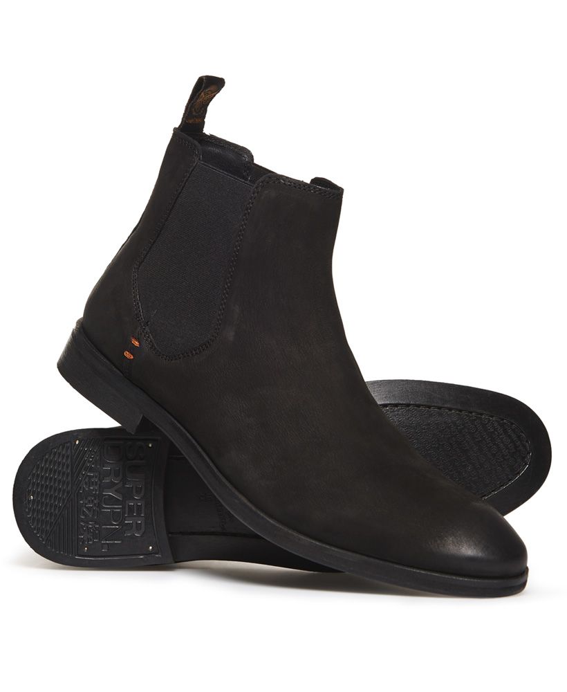 Superdry men's Meteora Chelsea boots. Classic design Chelsea boots in a vintage distressed finish, featuring a full leather upper, elasticated side panels and heel pull tabs. These boots are completed with leather soles and signature orange stitch detailing.