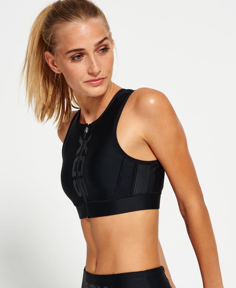 Superdry women’s Zip up bra. This high neck sports bra features soft-touch fabric with moisture wicking technology whilst creating the ultimate fitness look. The bra has a front zip fastening, mesh panel detail built for your comfort with a part elasticated Superdry Sport branded hem. The Zip up bra is finished with a reflective Superdry Sport SD-X logo on the front mesh panel.Model wears: SmallModel height: 5’ 9” (175cm)