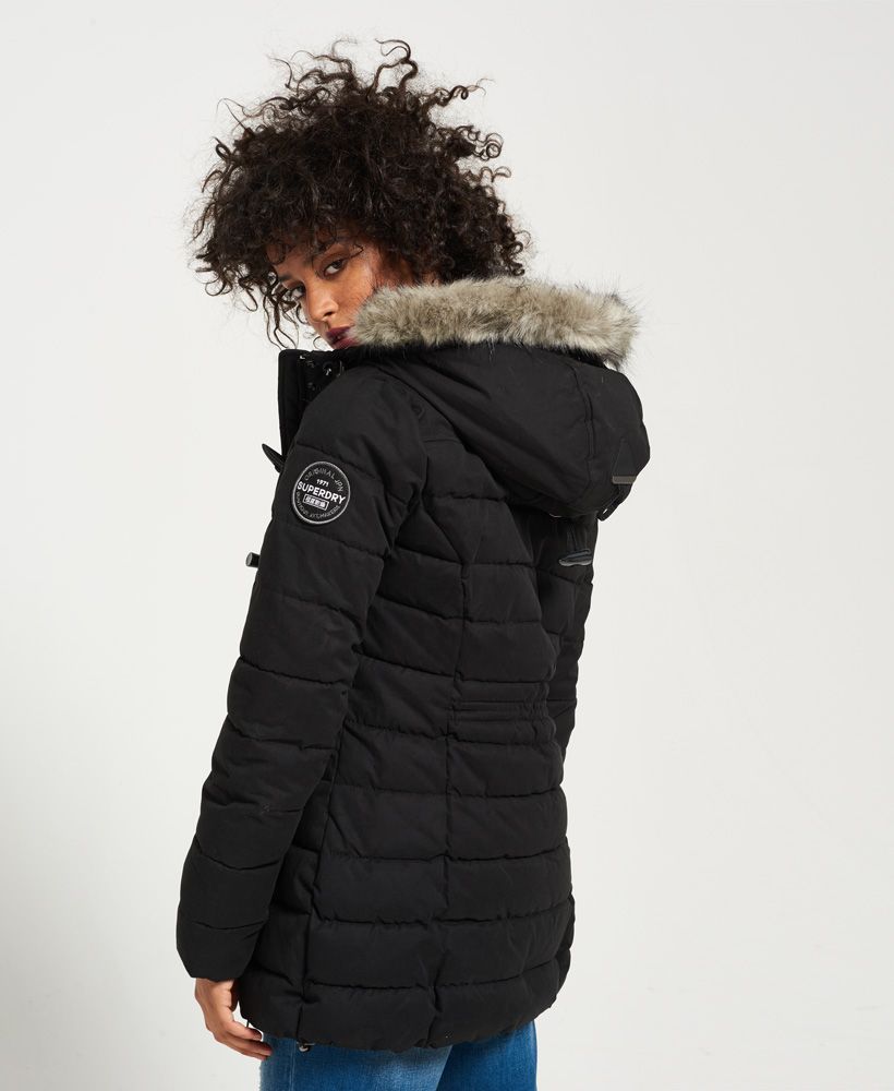 Superdry women’s Microfibre tall Toggle Puffle jacket. Stay warm whilst still being stylish in this long, fleece lined jacket that features a zipper and toggle fastening, two front zip fastened pockets and a fleece lined hooded with a faux fur trim. The Microfibre Toggle Puffle jacket is finished with an embroidered Superdry logo on the back and an Original Superdry logo badge on one sleeve.

Model wears: Small Model height: 5’ 9” (175cm) Model chest size: 29