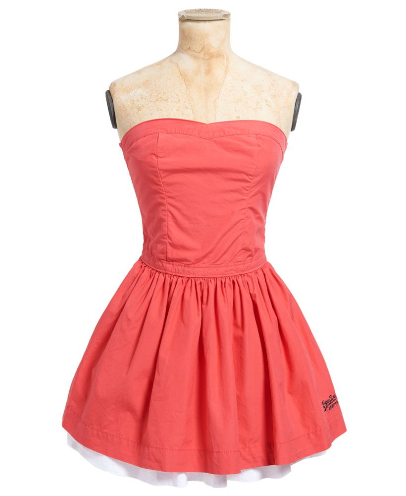 Superdry women's 50s dress. A 1950s inspired strapless mini-dress featuring a fitted bodice, elasticated back panel, two side pockets and contrast colour skirt lining. The 50s dress is finished with an embroidered Superdry logo on the hem.