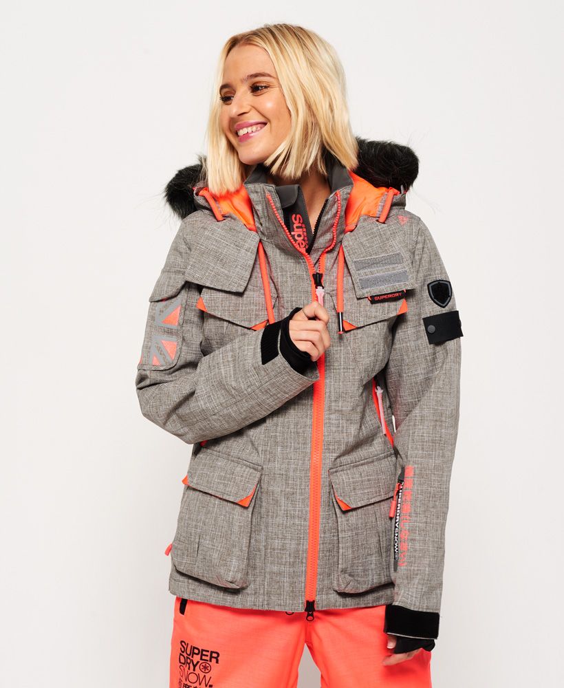 The Full Tech range from the Superdry Snow collection is designed for max performance with technical fabrics and high water resistance. This range is for skiers & boarders taking on advanced slopes and black runs.Superdry women's Ultimate Snow Service ski jacket. This ski jacket features a hood with a contrast colour lining, removable faux fur trim, drawstring adjuster, a double layer zip front fastening and taped seams to help keep the moisture out. The snow jacket benefits from eight outer pockets, a tech pocket with earphone cable routing and zipped underarm vents for added breathability. Keep your ski pass safe with a dedicated pocket on the sleeve. Inside, the removable snow skirt and snow cuffs will help keep the powder and cold out. The ski jacket is finished with Superdry logo prints on the shoulder and a Superdry Snow logo badge on the sleeve.Water resistance <10,000mm
Breathability <10,000g