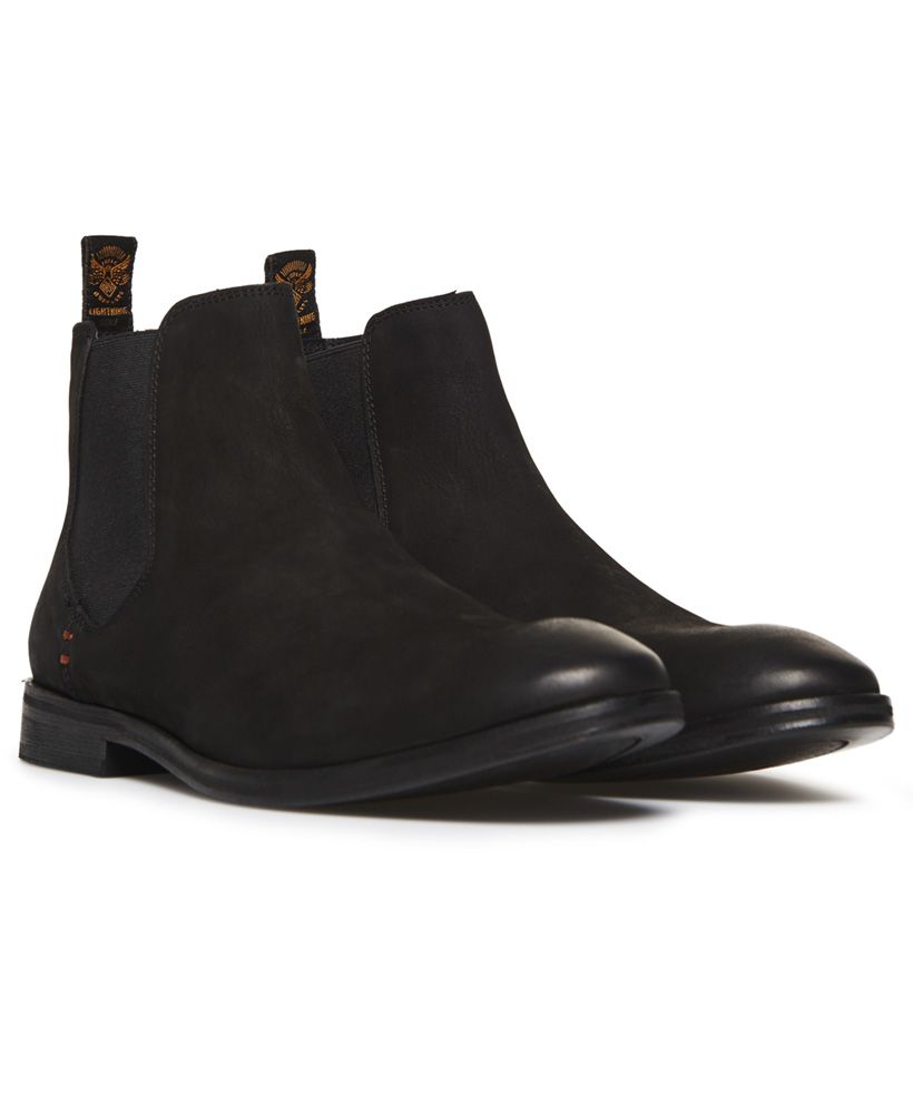 Superdry men's Meteora Chelsea boots. Classic design Chelsea boots in a vintage distressed finish, featuring a full leather upper, elasticated side panels and heel pull tabs. These boots are completed with leather soles and signature orange stitch detailing.