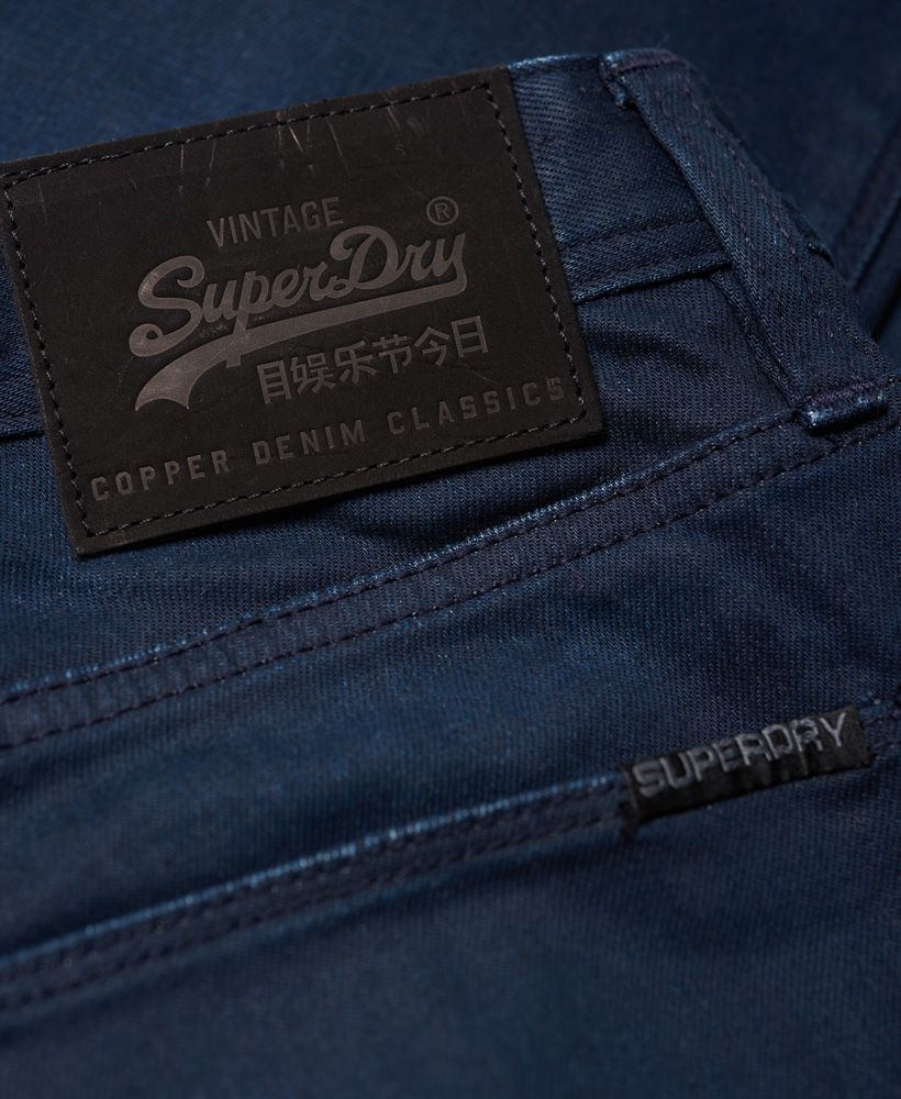 Superdry men's slim jeans. These slim fitting jeans have a classic five pocket design as well as a zip fly fastening and subtle embroidered Vintage Superdry logo on the coin pocket. The Corporal Slim Jeans are finished with a logo patch on the back waistline and a Superdry logo tab on one of the back pockets.