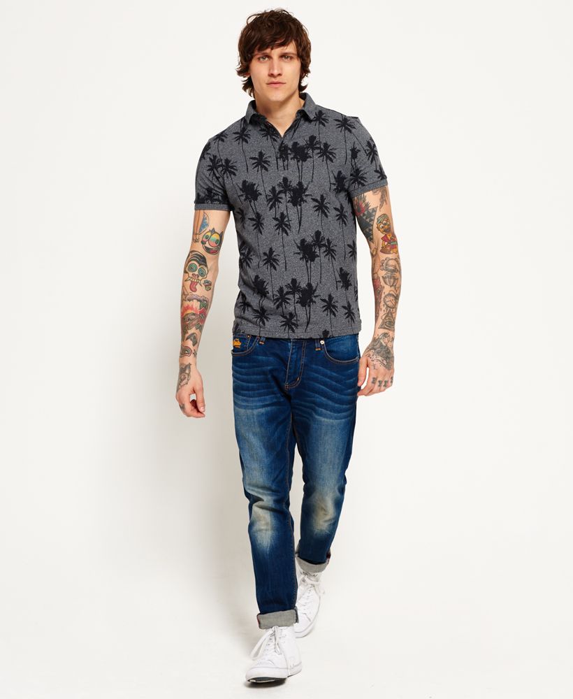 Superdry men’s City all over print polo shirt. A short sleeve jersey polo shirt that has a three button fastening and an all over palm tree print fabric. A lightweight polo shirt that can be paired with International chino shorts for a fresh summer look. The City polo shirt is finished with a Superdry logo badge on the sleeve and a tri-colour logo patch in the placket. Model wears: Medium Model height: 6’ 1” (185cm) Model chest: 37