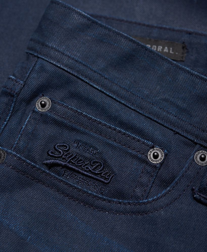 Superdry men's slim jeans. These slim fitting jeans have a classic five pocket design as well as a zip fly fastening and subtle embroidered Vintage Superdry logo on the coin pocket. The Corporal Slim Jeans are finished with a logo patch on the back waistline and a Superdry logo tab on one of the back pockets.