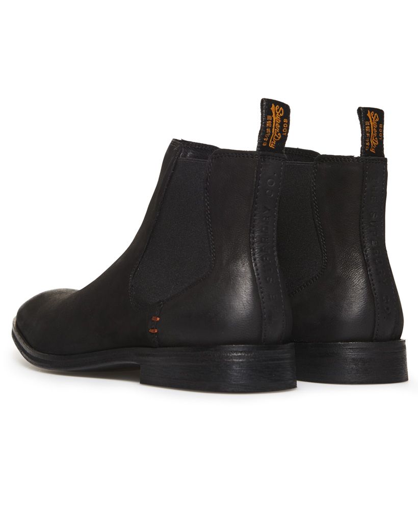 Superdry men's Meteora Chelsea boots. Classic design Chelsea boots in a vintage distressed finish, featuring a full leather upper, elasticated side panels and heel pull tabs. These boots are completed with leather soles and signature orange stitch detailing.