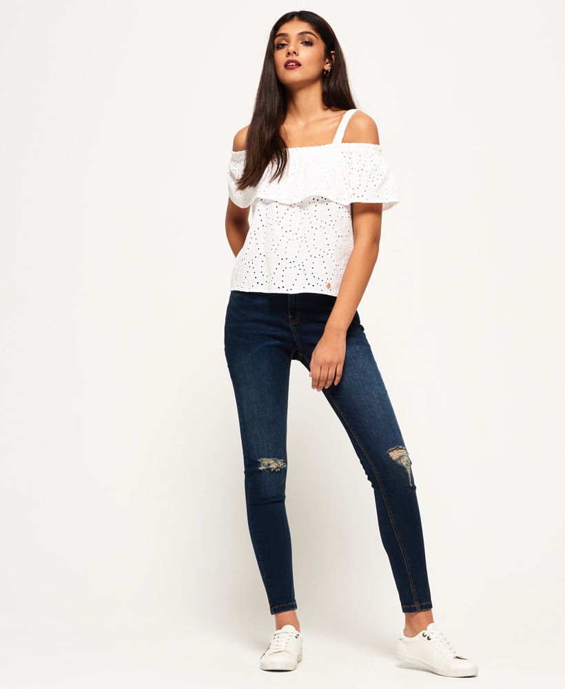 Superdry women’s Mimi Schiffli top. The Mimi Schiffli top features an all over lace insert pattern, a cold shoulder design and is finished with a Superdry logo badge near the hem.Model wears: Small Model height: 5’ 10” (178cm) Model chest size: 32