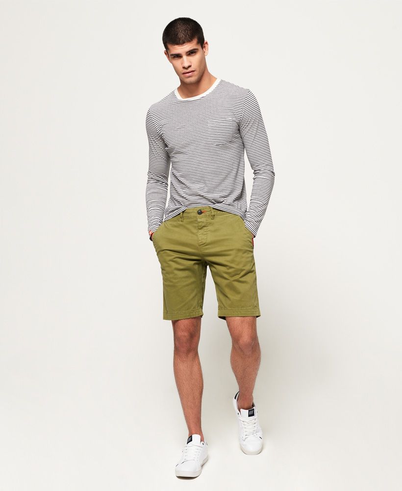 Superdry men's International Chino shorts. A pair of chino shorts in a soft cotton twill, featuring a five pocket design and button fly. The International Chino Shorts are finished with a Superdry logo patch on the front and back pockets.