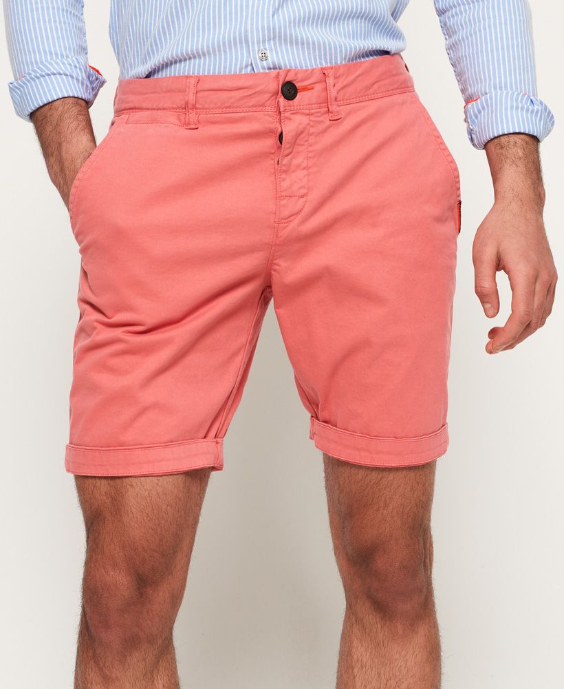 Superdry men's International Chino shorts. A pair of chino shorts in a soft cotton twill, featuring a five pocket design and button fly. The International Chino Shorts are finished with a Superdry logo patch on the front and back pockets.