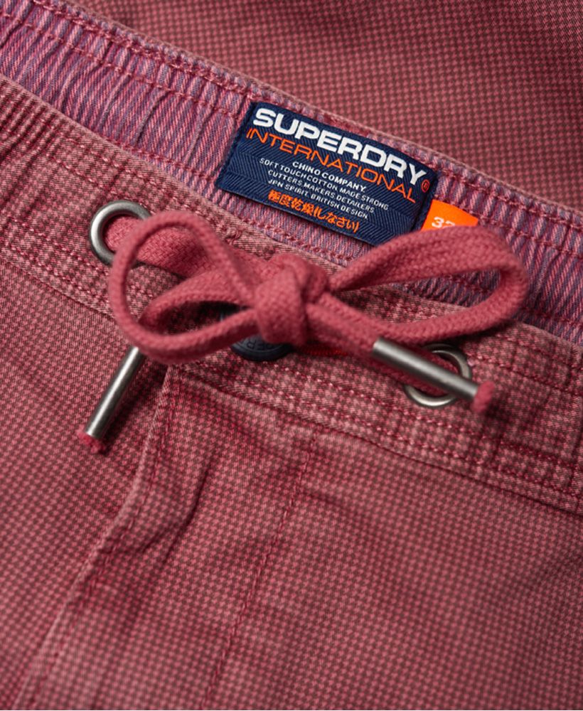 Superdry men's Sunscorched shorts. These shorts feature a five pocket design, one with a button and small coin pocket. Also featured is a zip and button fastening and drawstring waist to adjust for comfort. Complete with a textured stripe design, Superdry logo badge on one back pocket and Superdry logo tab on one front pocket.