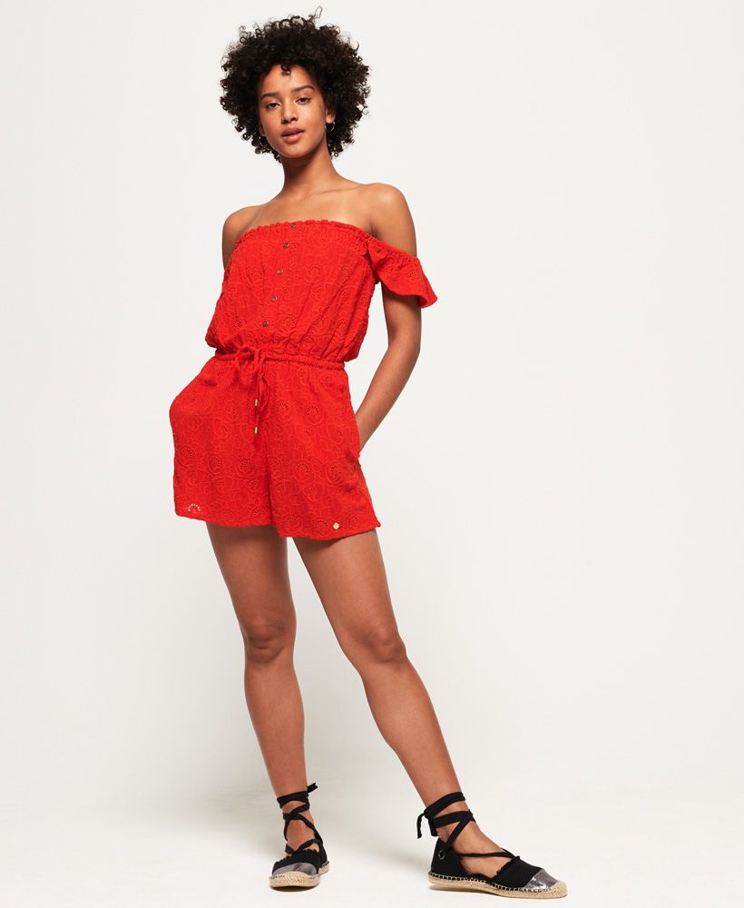 Superdry women’s Lilah Schiffli playsuit. This bardot style playsuit has been created using a delicate schiffli lace material and features an elasticated, drawcord adjustable waist and is finished with a faux front button fastening.