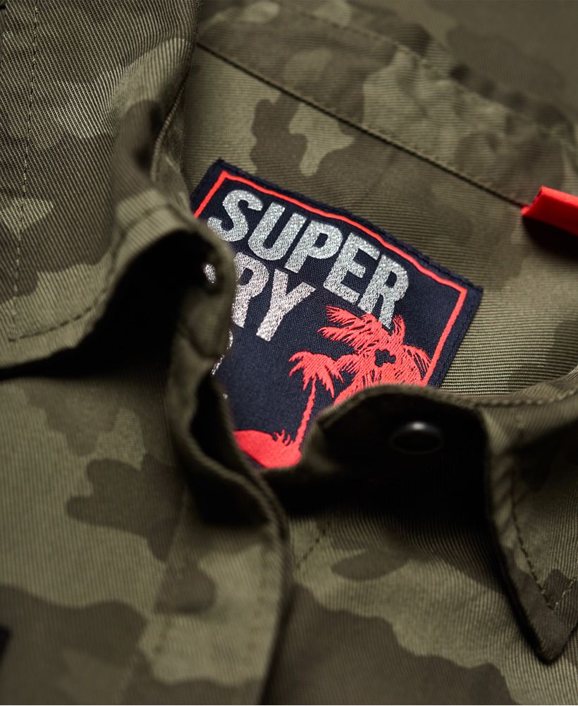 Superdry women’s Emma military shirt. This military inspired shirt features a button down fastening, twin chest pockets and button cuffs. The Emma military shirt also features shoulder epaulettes, various applique Superdry logo badges and is finished with a Superdry logo badge above the hem.