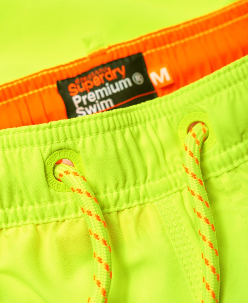 Superdry men’s Beach Volley swim shorts. These swim shorts feature a drawstring adjustable waist, a full mesh lining and two front pockets and one zip fastened one at the rear. The Beach Volley swim shorts are finished with an embroidered Superdry logo above the hem.