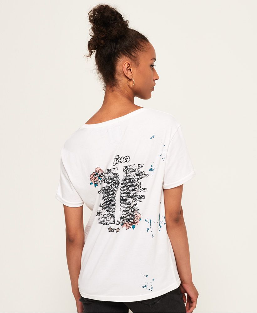 Superdry women’s boyfriend band t-shirt. A crew neck tee featuring a large Superdry logo graphic across the chest and on the reverse. This t-shirt is finished off a paint splatter effect and a logo badge just above the hem.