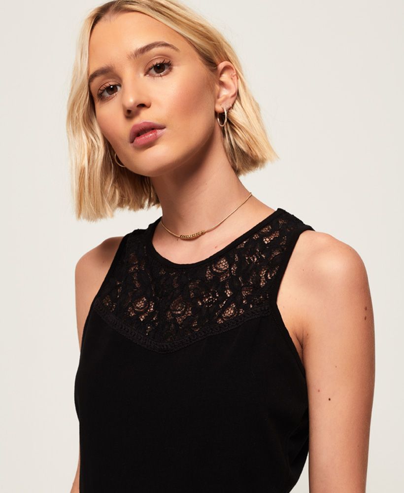 Superdry women’s Ivy lace vest top. This vest top features a detailed lace pattern on the chest and is finished with a Superdry logo patch near the hem. This is a staple piece for any wardrobe, and can be dressed up or down.