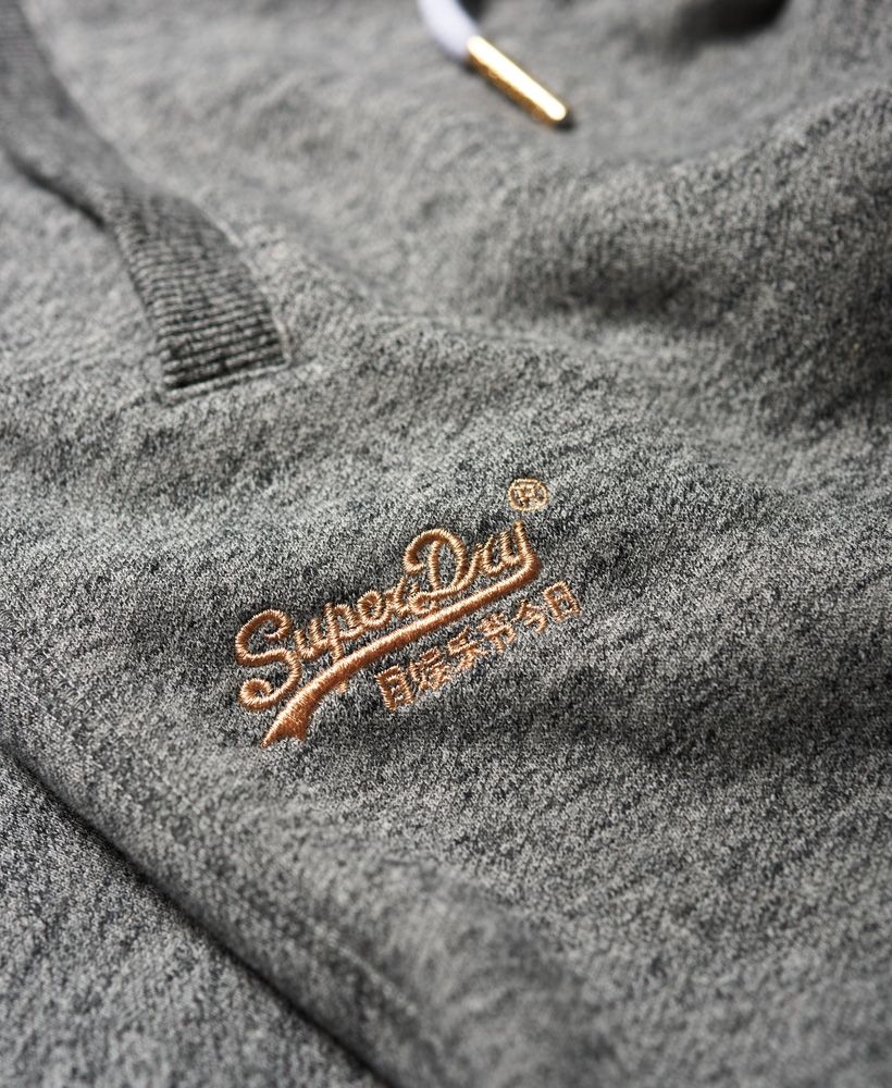 Superdry women’s Elite joggers from the Orange Label range. A premium slim leg, cuffed jogger featuring a drawstring adjustable, elasticated waistband with metal detailing, two front pockets and a single rear pocket. These soft touch joggers are finished with an embroidered Superdry logo below one of the front pockets.Slim fit