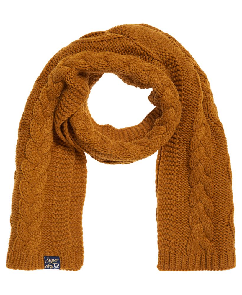 Superdry women’s Arizona cable scarf. This cable knit scarf is perfect for cold weather, it is perfect to keep warm and adds a stylish element to any outfit. The Arizona cable has been finished with a Superdry logo on the hem.